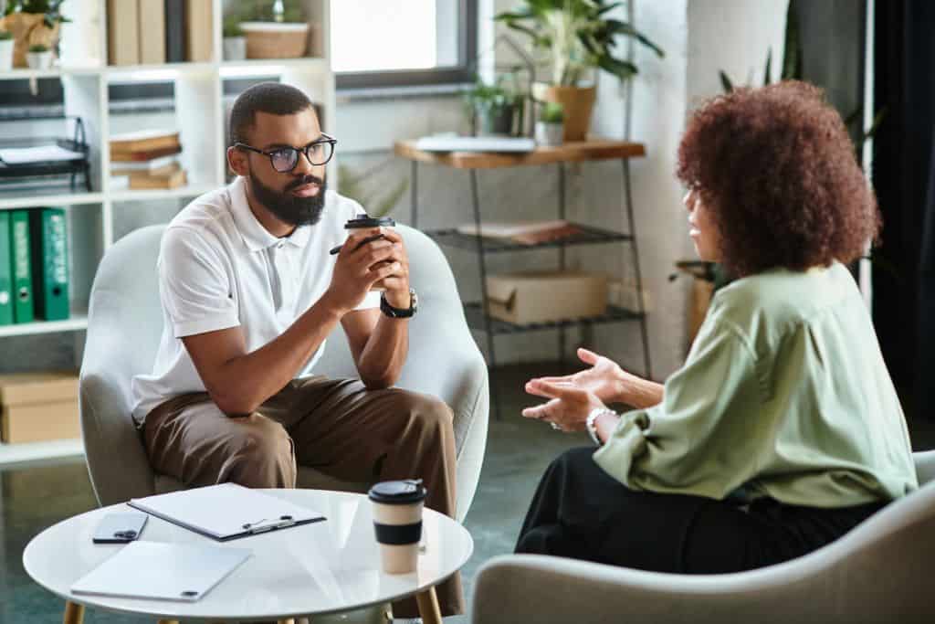 adult woman talking to a therapist during a counseling session, concept of mental health consultation