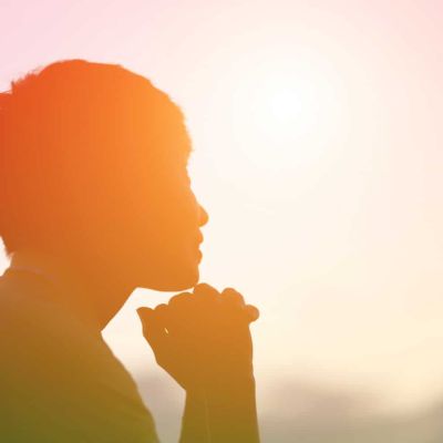 blurred, tinted image of woman looking, smiling at sunset, concept of self, thinking